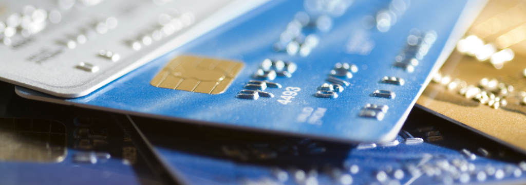 Pile of credit cards, narrow focus.