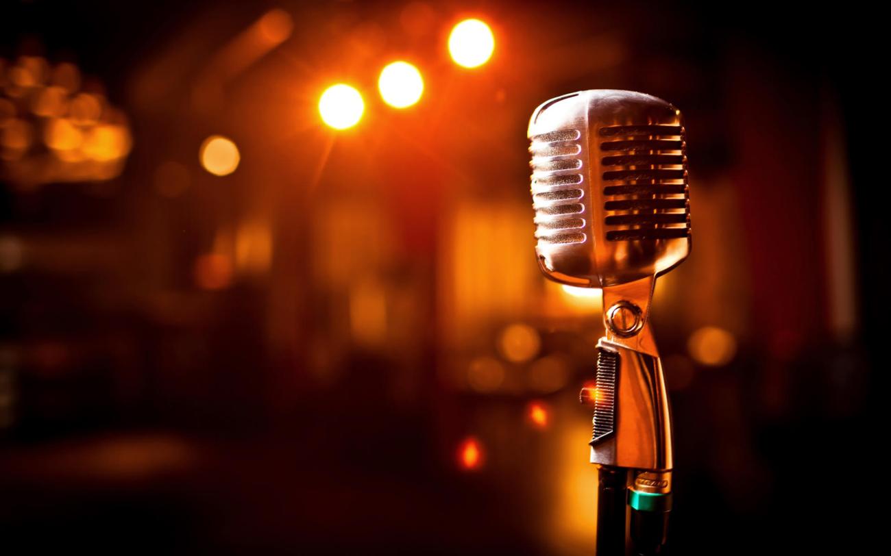 Retro microphone on stage in restaurant. Blurred background